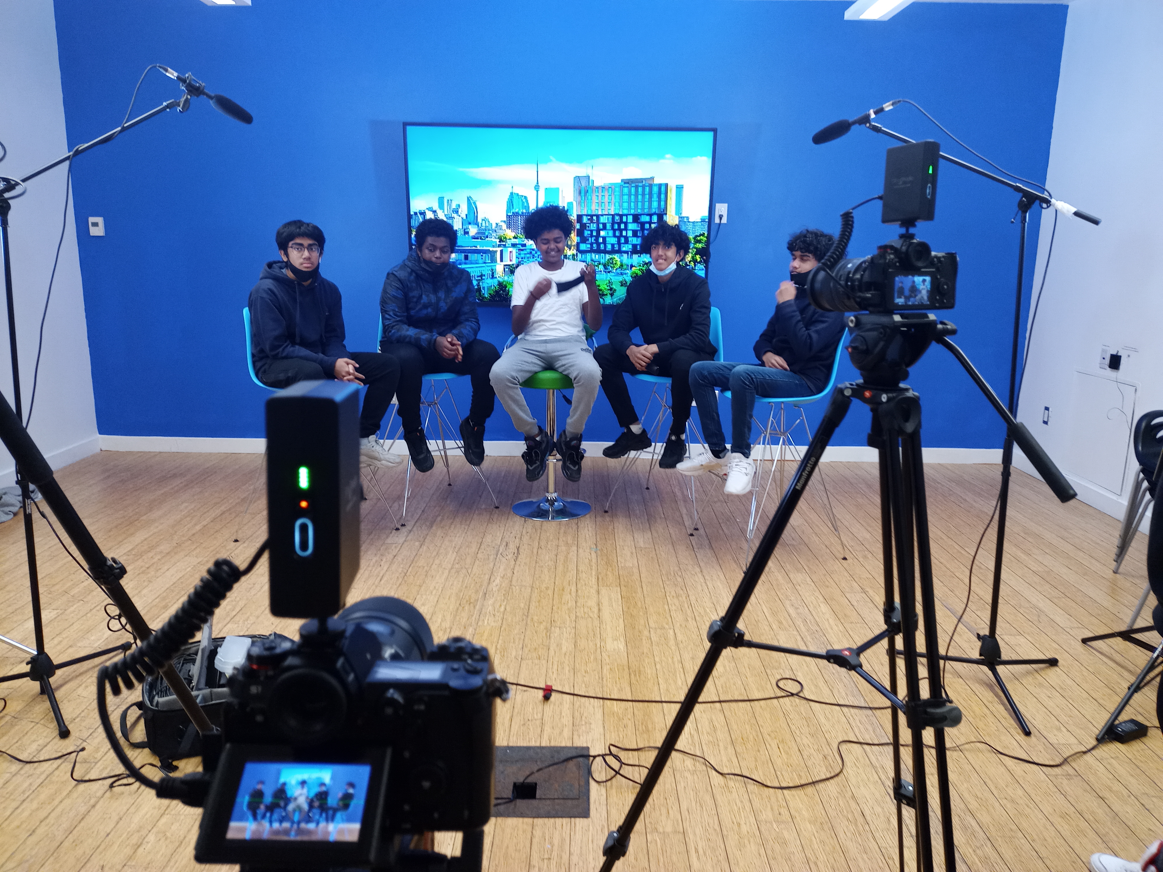 Community members filming in Regent Park